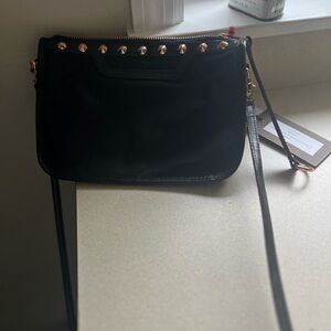 MZ Wallace
Sleek Black Crossbody Bag with Glossy Finish and copper studs